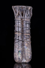 ROMAN GLASS DOUBLE UNGUENTARIUM

 Ca. 200-300 AD
 A double-tube glass balsamarium with decorative applied trails around both rims and bodies in a d...