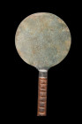 ROMAN BRONZE MIRROR

 Ca. 100-300 AD
 A bronze mirror, exquisitely crafted with a flat section and circular shape. The mirror boasts a sturdy resto...
