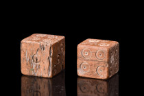 ROMAN BONE PAIR OF GAMING DICE

 Ca. 100-200 AD
 A pair of bone dice with carefully carved dot-in-circle pips, typical of the Roman period. The Rom...