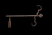 ROMAN IRON STEELYARD

 Ca. 100-300 AD
 This steelyard boasts a rod with a pointed finial on one end and an openwork circular decorative terminal on...