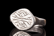 MEDIEVAL SILVER RING WITH DECORATION 

 Ca. 1200-1300 AD
 A silver ring fashioned from a round, flat-section hoop, it boasts an intricately engrave...