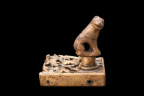 MEDIEVAL BRASS FITTING WITH ANIMAL

 Ca. 15th-16th century AD
 A brass corner fitting, boasting a straight angle frame and an enchanting arabesque-...