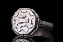 MEDIEVAL BRONZE RING WITH MOON CRESCENTS 

 Ca. 1200-1400 AD
 A bronze ring crafted with utmost care and skill to create a truly stunning piece of ...