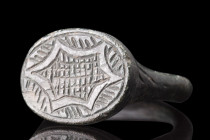 CRUSADERS ERA BRONZE RING WITH SIX-POINTED STAR

 Ca. 1100-1400 AD
 A bronze ring crafted with exquisite detail. Its slender hoop is seamlessly joi...