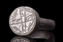 MEDIEVAL BRONZE RING WITH STAR OF BETHLEHEM

 Crusaders Era, ca. 1100-1400 AD
 A bronze finger ring comprising a round hoop and large circular beze...