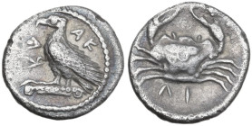 Sicily. Akragas. AR Litra, c. 450-440 BC. Obv. AK-PA (retrograde). Eagle standing left on Ionic capital. Rev. Crab; ΛI (mark of value) below. HGC 2 12...