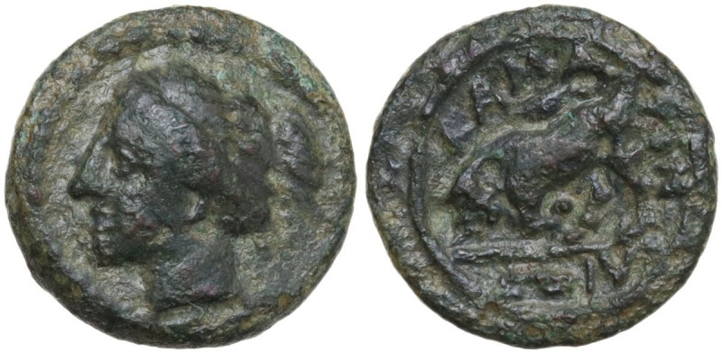 Sicily. Kamarina. AE 12 mm, circa 310-290 BC. Obv. Female head left. Rev. Bull c...