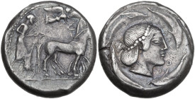 Sicily. Syracuse. Gelon (485-478 BC). AR Tetradrachm. Struck circa 478-475 BC. Obv. Charioteer driving slow quadriga right, holding kentron in right h...