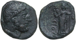 Sicily. Syracuse. Under Roman Rule. AE 18 mm., First century BC. Obv. Diademed head of Serapis right, wearing atef crown. Rev. Isis standing left, hol...