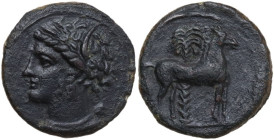 Punic Sicily. AE 16 mm, late 4th-early 3rd century BC. Obv. Head of Tanit left, wearing wreath of grain. Rev. Horse standing right before palm tree. S...