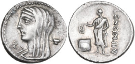 L. Cassius Longinus. AR Denarius, 63 BC. Obv. Veiled and draped bust of Vesta left; on right, dish; on left, control-letter. Rev. Voter standing left,...