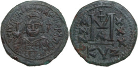 Justinian I (527-565). AE Follis, Cyzicus mint, dated RY 30 (556-557). Obv. Helmeted and cuirassed bust facing, holding globus cruciger and shield; to...