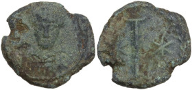 Justinian I (527-565). AE Decanummium. Rome mint. Struck 547-549 AD. Obv. Helmeted and cuirassed bust facing, holding globus cruciger and shield. Rev....