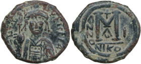 Maurice Tiberius (582-602). AE Follis, Nicomedia mint, dated RY 1 (582-583). Obv. Crowned and cuirassed bust facing, holding globus cruciger and shiel...