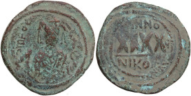 Phocas (602-610). AE Follis, Nicomedia mint, dated RY 5 (606-607). Obv. Crowned bust facing, wearing consular robes, holding mappa and sceptre. Rev. X...