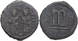 Phocas with Leontia (602-610). AE Follis, Theoupolis (Antioch) mint. Obv. Phocas and Leontia standing facing; the emperor holds globus cruciger, the e...