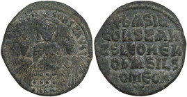 Basil I the Macedonian, with Constantine and Leo VI (867-886). AE Follis. Constantinople mint, 870-879. Obv. Crowned half-length figures of Basil, wea...