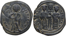Constantine X Ducas, with Eudocia (1059-1067). AE Follis. Constantinople mint. Obv. Christ standing facing on footstool, holding Gospels. Rev. Constan...