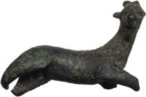 BRONZE GOAT FIGURINE Roman period, c. 1st-3rd century AD. Bronze statuette of a goat, represented lying down and with its head raised. Dimensions: 35x...