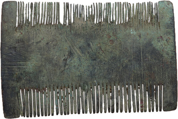 DECORATED ROMAN BRONZE COMB Roman to Migration Period. Bronze double sided comb,...