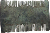 DECORATED ROMAN BRONZE COMB Roman to Migration Period. Bronze double sided comb, with teeth of different size and spacing on the sides. Engraved line ...