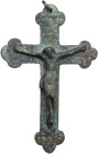 BRONZE CROSS Modern Age, c. XVII-XVIII century AD. Sturdy bronze cross with hole and ring to be worn. Engraved decoration with crosses, dots and lines...