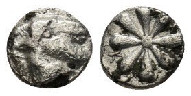 ASIA MINOR. Uncertain (Ionia?). Hemiobol (5th-4th centuries BC). (0.5 Gr. 8mm.)
 Star. 
Rev. Lion (?)
