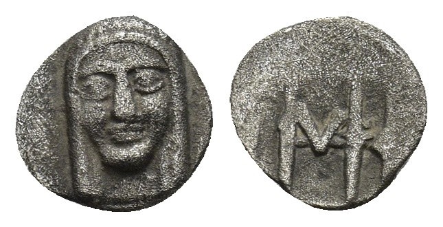 Ionia, Kolophon, c. 450-410. AR Hemiobol. Facing head of Apollo. R/ Monogram (ma...