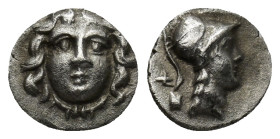 Pisidia, Selge, c. 250-190 BC. AR Obol (10mm, 0.72 g). Facing gorgoneion. R/ Helmeted head of Athena r.; behind neck, astragalos above uncertain symbo...