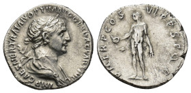 Trajan AR Denarius. Rome, AD 114-117. (2.78 Gr. 18mm.)
Laureate and draped bust right 
Rev. Genius standing facing, nude, head left, holding patera in...