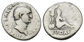 Vespasian, A.D. 69-79. AR Denarius. Judaea Capta issue. Rome, A.D. 69-70 . (2.69 Gr. 17mm)
Laureate head of Vespasian right. 
Rev. IVDAEA, trophy bene...