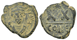 PHOCAS (602-610). Half Follis. Constantinople (5 Gr. 21 mm.)
 Crowned bust facing, wearing consular robes, holding mappa and cross; star in left field...
