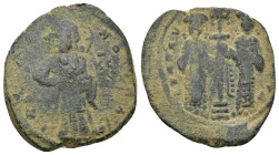 Constantine X. 1059-1067. AE follis. (7.3 Gr. 28 mm.)
 Christ standing facing on footstool, holding book of Gospels 
Rev. Eudocia on left and Constant...
