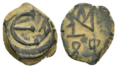 Justin II AE. 5 Nummi. Antioch, AD 569-578. (1.5 Gr. 18mm)
Monogram 
Rev. Large E, cross to right.