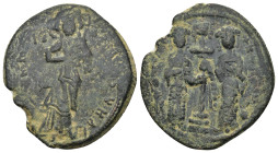 Constantine X. 1059-1067. AE follis. (8.1 Gr. 34mm.)
 Christ standing facing on footstool, holding book of Gospels 
Rev. Eudocia on left and Constanti...