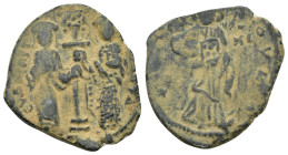 Constantine X. 1059-1067. AE follis. (5 Gr. 28mm.)
 Christ standing facing on footstool, holding book of Gospels 
Rev. Eudocia on left and Constantine...