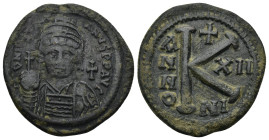 Justinian I. AD 527-565. Nicomedia Half Follis AE. (11.48 Gr. 28mm.) 
Helmeted, pearl-diademed and cuirassed bust facing, holding globus cruciger and ...