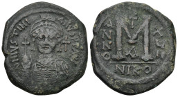 Justinian I (527-565). AE 40 Nummi (20 Gr. 34mm.). Nicomedia.
 Helmeted and cuirassed facing bust, holding globus cruciger and shield; cross to right....
