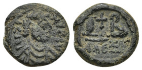 Justin II (565-578). AE 12 Nummi (2.49 Gr. 13mm). Alexandria.
 Diademed, draped and cuirassed bust right. 
Rev. Cross potent set on three steps; I B a...