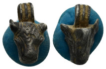 A silver bull' s head pendant. 19mm, 3.6 gr.
