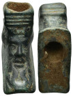 Bronze object with male head. 35mm, 18.9 gr.