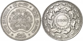 1957. Ceilán. 5 rupias. (Kr. 126). 28,24 g. AG. 2500 años de Budismo. Leves golpecitos. S/C-.