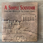 VAN ALFEN P. - A Simple Souvenir: Coins and Medals of the Olympic Games. Pp. 146; ill. col. Copertina rigida. Ottimo stato