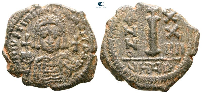 Justinian I AD 527-565. Theoupolis (Antioch)
Decanummium Æ

24 mm, 4,90 g

...