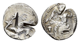 KINGS of CAPPADOCIA. Ariarathes I.(Circa 333-322 BC).Gaziura. Drachm.

Obv : Baal seated left, holding eagle, grape cluster and grain ear in right h...