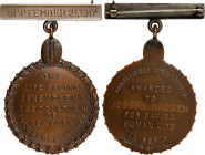 1917 Life Saving Benevolent Association of New York Badge. By Tiffany & Co. Bronze. Mint State.
28 mm x 42.5 mm. Obv: Wreathed border encloses the in...