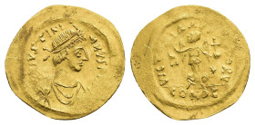 IMPERIO BIZANTINO. JUSTINIANO. Tremissis. Constantinopolis. A/ Busto del emperador a der. R/ Victoria mirando a izq. con globo crucífero y corona, en ...