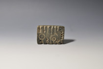 PRÓXIMO ORIENTE. Mesopotamia. Molde para joyas (I milenio a.C.). Piedra. Longitud 10 cm. Ex colección S.M. (Londres; 1970-1990).