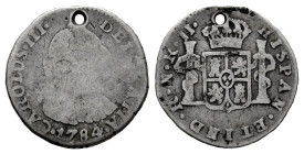 Charles III (1759-1788). 1/2 real. 1784. Santa Fe de Nuevo Reino. JJ. (Cal-275). (Restrepo-32-13). Ag. 1,74 g. Holed. Without dot between assayers. Ac...