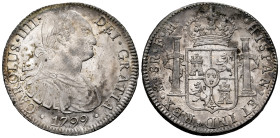 Charles IV (1788-1808). 8 reales. 1799. Mexico. FM. (Cal-963). Ag. 26,95 g. Original luster. Minimal hairlines on obverse. Attractive specimen. Very s...